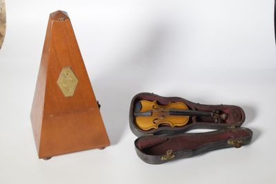 a violin and a violin case next to each other