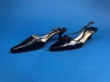 a pair of black shoes on a blue background