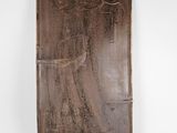 an image of a metal plaque with an angel on it ' s side