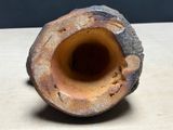 a close up of a piece of wood with a hole in it