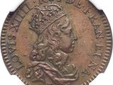 a close up of a coin with a crown on it