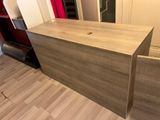 a large wooden box sitting on a hard wood floor