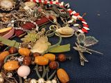 a pile of assorted jewelry on a blue table