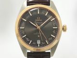 une image d'un gros plan d'une montre-bracelet avec un bracelet marron