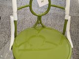 a green chair that is sitting in a store