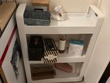 a small refrigerator in the corner of a kitchen