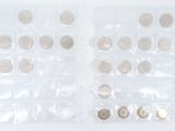 two bags of coins sitting on a white surface