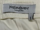 the label of a white suit with black writing on it