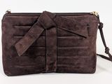 a brown purse with a bow on the front of it