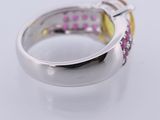 an image of a close up of a ring with pink and yellow stones