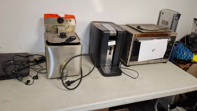 a lot of appliances that are sitting on a table