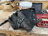 a lot of tools sitting on a workbench in a garage