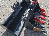 a close up of a fork attachment on the ground