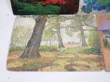 four paintings on the table and one of them is a painting