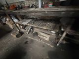 a wooden table that has a bunch of tools on it