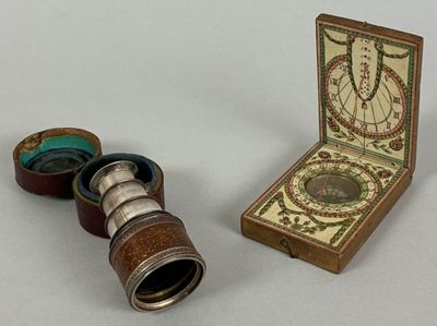 a small box with a pair of binoculars next to it