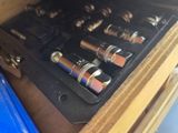 a close up of a drawer with a bunch of screws in it