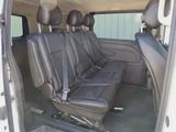 four seats in the back of a van that is empty