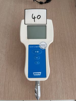 an image of a digital meter on a wooden table