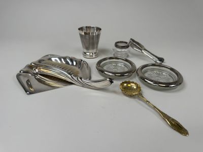 a lot of silver items that are on the table