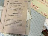 a pile of old letters and envelopes on the floor