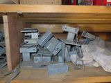 a pile of old electrical equipment on a wooden shelf