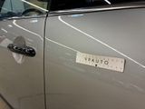 a sticker on the door of a car that says caution
