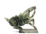 a statue of a horse with a rider on it ' s back