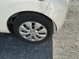 a white car parked on the side of the road