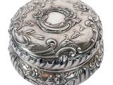 an image of a silver box with a floral design on it
