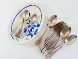 a plate with spoons and spoons on it next to a plate with spoons