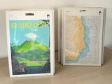 two boxes that have maps on them on a table