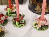 many candles that are sitting on a table