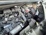 a picture of a car engine that is under the hood