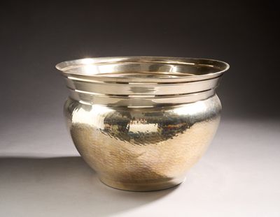 a silver bowl that is sitting on a table