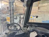 a view of the inside of a truck from the driver ' s seat