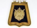 an image of a gold and black badge on a black and white background
