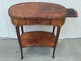 an old wooden table with a shelf on top of it