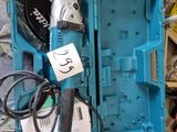 a blue box with tools in it on the floor