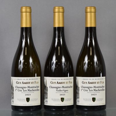 three bottles of wine sitting on top of a table next to each other