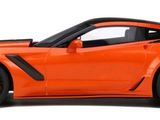 an orange sports car that is on display on a white background