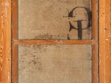 a picture of an old window with the letter g painted on it