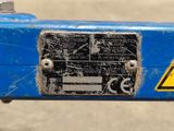 a close up of a sign on the back of a blue bike