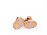 a pair of rose gold earrings with diamonds