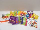 several children ' s books on a white table with a white background