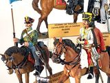 many figurines of soldiers on display on a table