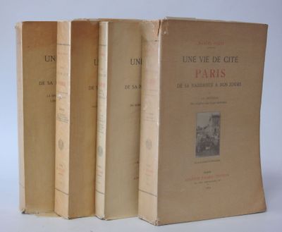 three books sitting on top of each other on a white surface