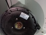 a black blower sitting on top of a white shelf