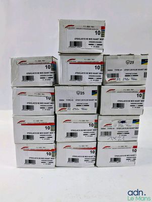 several boxes of mail sitting on top of each other on a table