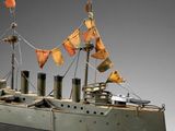 a model of a ship with flags on it